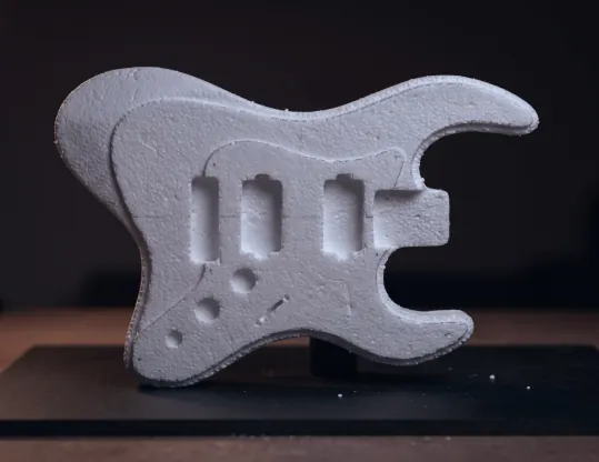 Thermocol prototype body on a dark stand.